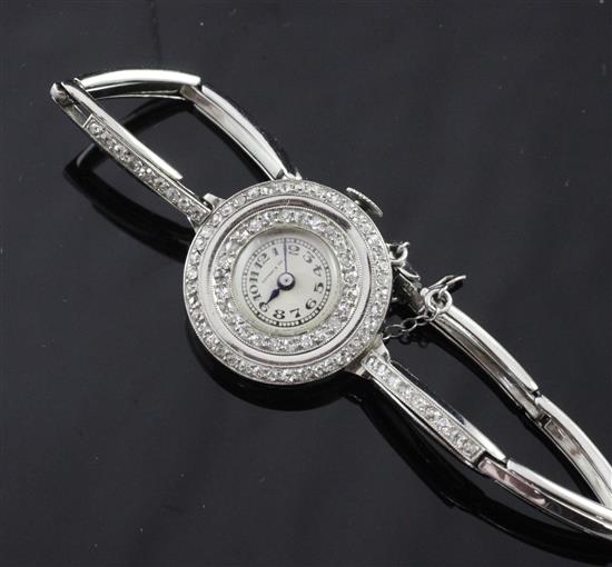 A ladys mid 20th century platinum and diamond set cocktail watch retailed by Tiffany & Co,